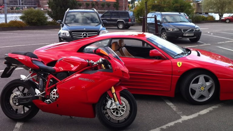 Ducati motorcycle and Ferrari sportscar